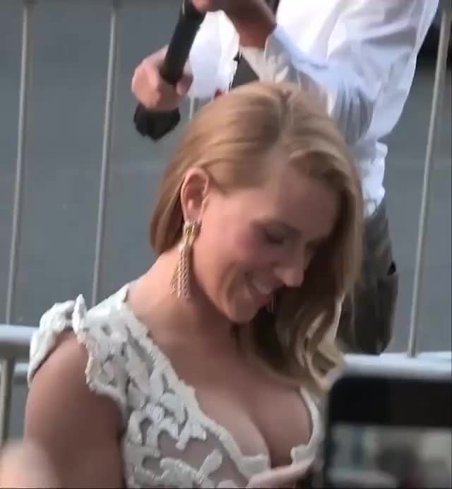 Scarlett Johansson's tits almost pulling out of her dress