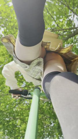 Riding a scooter without panties in a public park