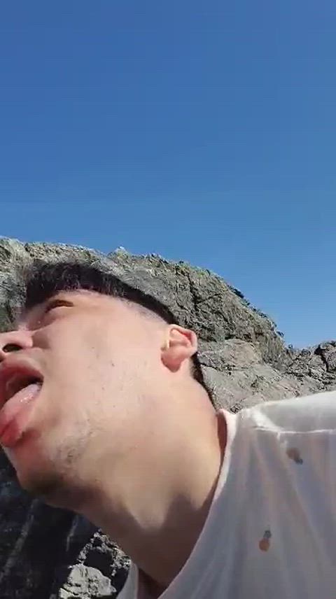 Twink cumslut licking cum off his fingers outside