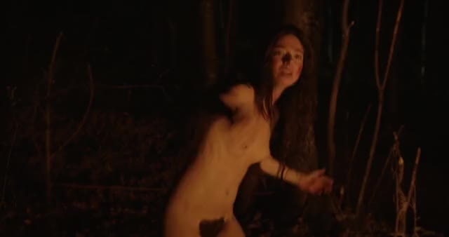 Aubrey plaza, dancing around a camp fire