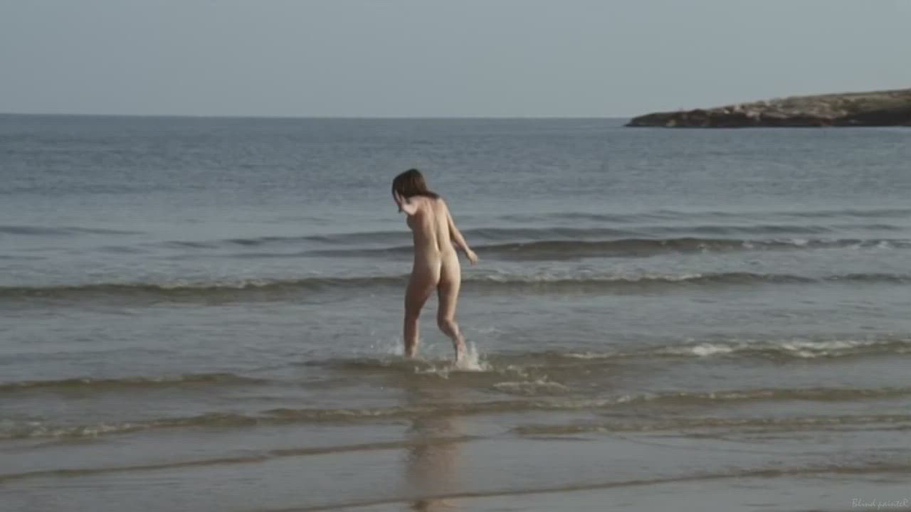 4 friends skinny dipping in the morning after camping on the beach. A whale showed