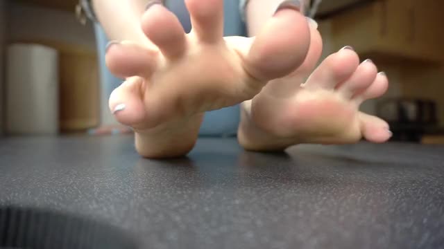 PUTTING MY FEET UP ON THE KITCHEN WORKTOP.