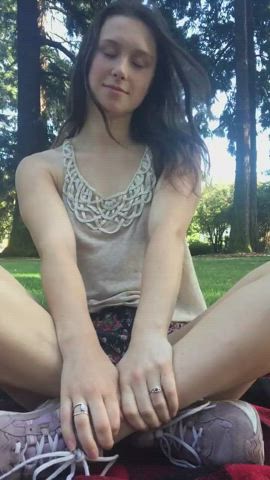 Cute brunette tries not get caught in park