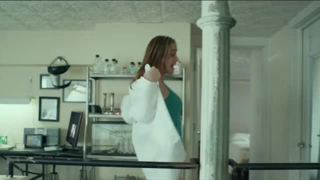 Brie Larson - Basmati Blues (2017) - aqua-green tank top singing sequence in lab