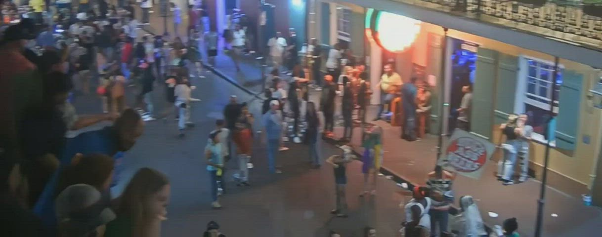 group of friends flashing m and f on bourbon street