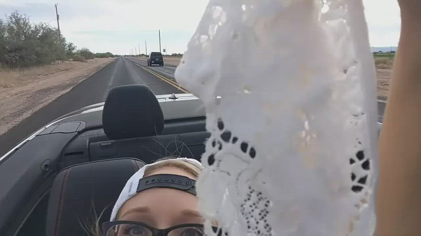 Two friends having fun in convertible