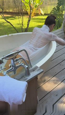 Stephanie teases in her outdoor tub. That ass looks delicious!