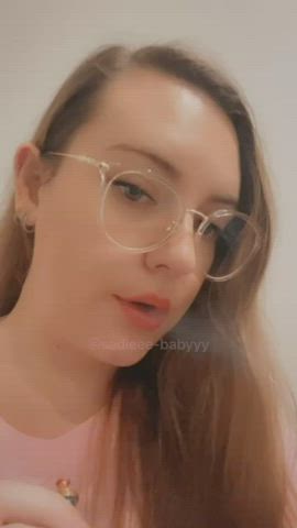 brunette cute girlfriend glasses pink smoking teasing tiktok tongue fetish gif