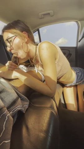 Breathtaking girl with glasses swallows a BBC in the backseat of car