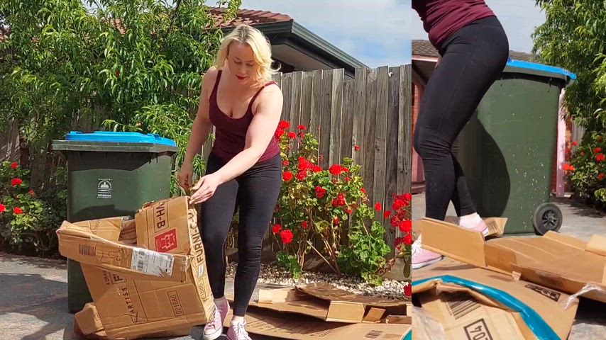 Stomping cardboard boxes flat ready for recycling