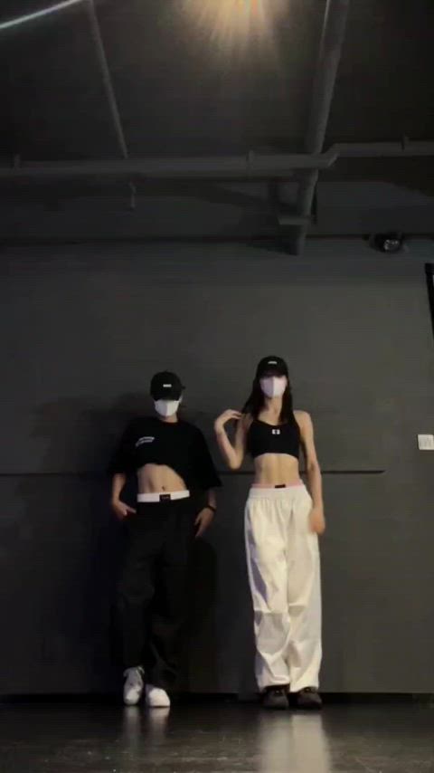 brunette dancing mask teasing gif