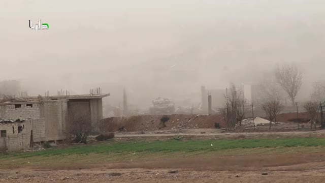 Syrian T-72 engages an FSA fighter hiding behind a dirk embankment