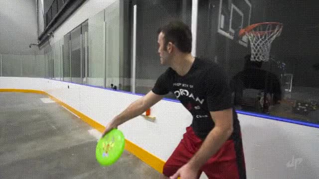 Brody Smith throwing a frisbee all the way around to himself