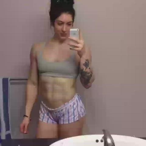 Clothed Muscular Girl Tattoo gif