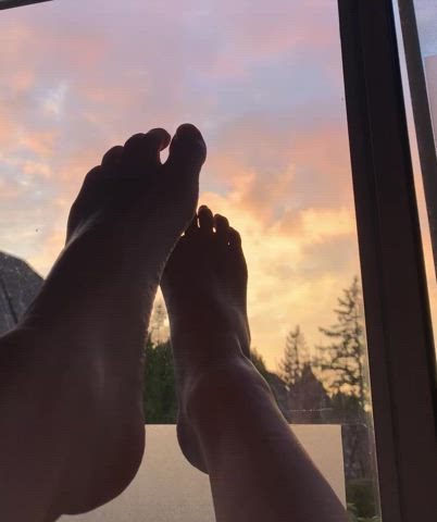 Artistic, beautiful silouhette of feet moving under the sunset