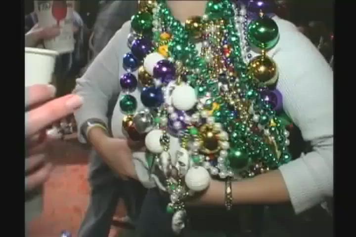 Tasting her friend at Mardi Gras