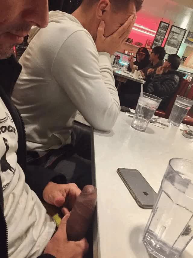 Guy has hard cock out at eating establishment ...