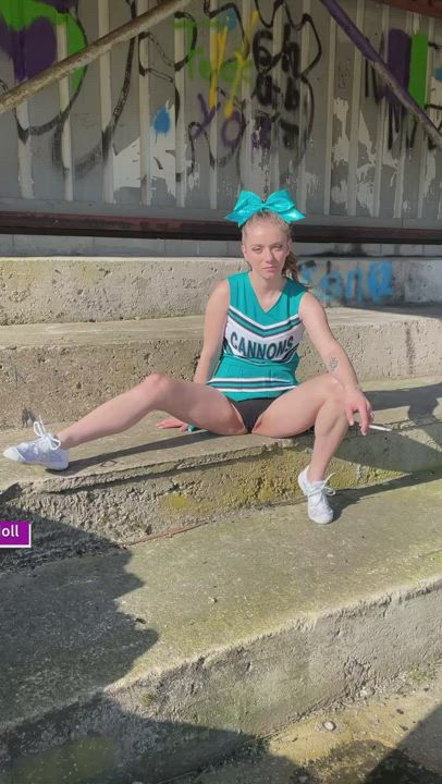 Cheeky cheerleader sneaking off for a smoke