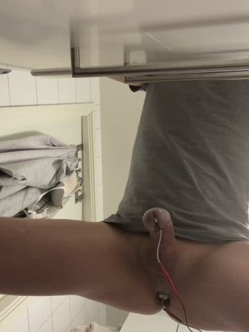 A sperm stopper and a 4,5cm diam. butt plug hooked up to the e-stim device always