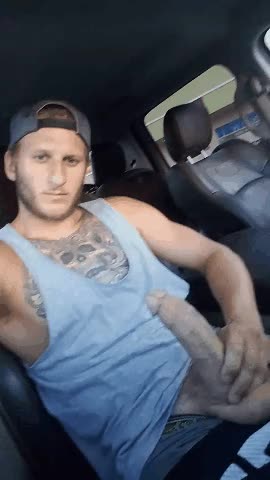 Playing with my massive cock in the car