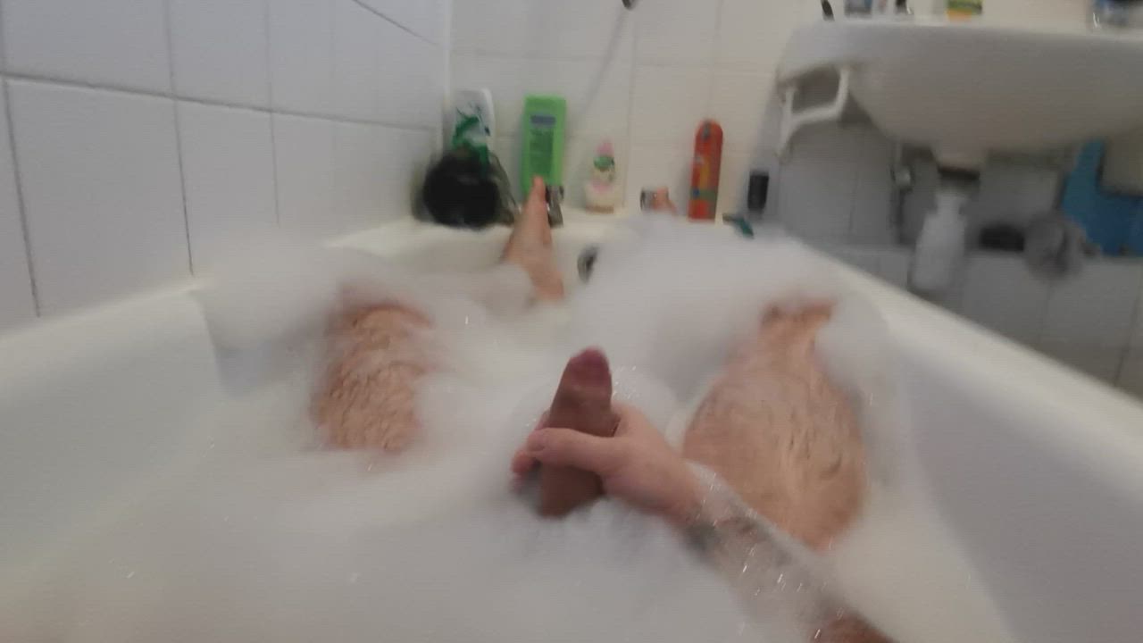 Enjoying stroking in the bath
