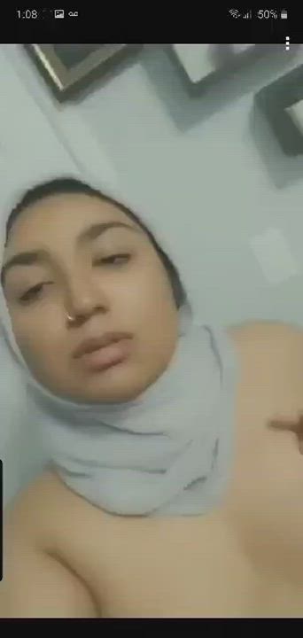 Horny hijabi teen plays with her tits