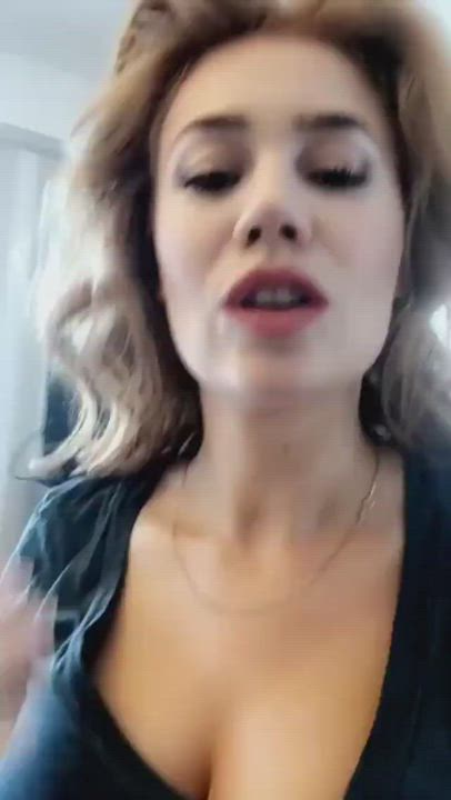 Make-up artist prepares Palina Rojinski's cleavage for the upcoming interview