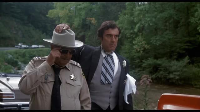 Smokey-and-the-Bandit-1977-GIF-00-59-19-hand-on-hat