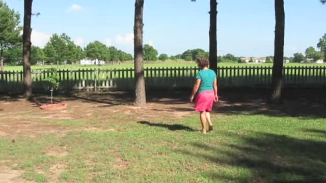 Walking  In Yard and about to take off shirt