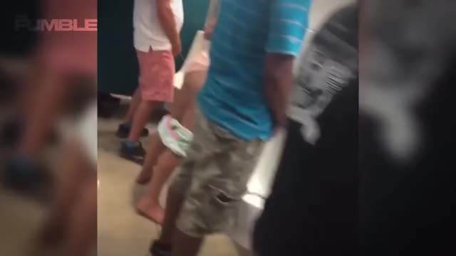 Drunk Female Dolphins Fan Stumbles into Men's Bathroom, PEES in the Urinal!