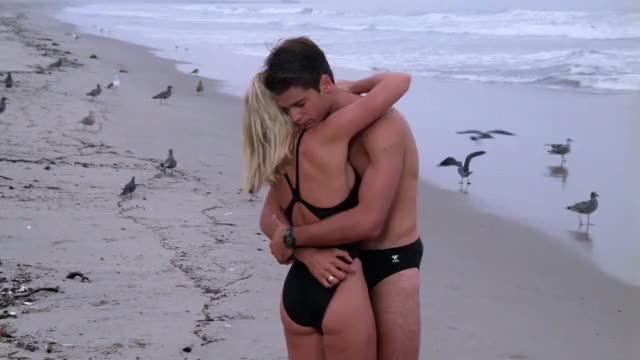 Nicole Eggert - Baywatch - S4E16 - backstory in black swimsuit, being spun around