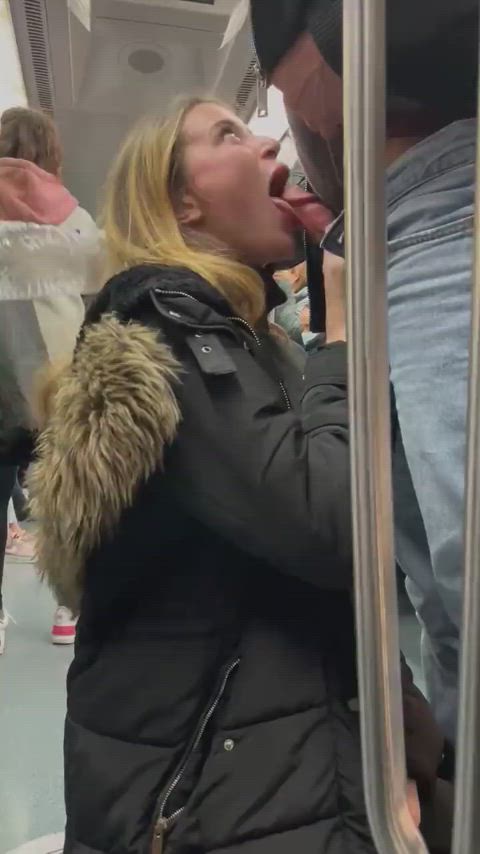 Blonde slut sucking a guy on a metro