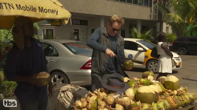 Conan cuts a coconut