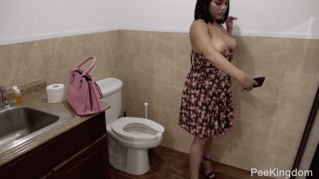 Hot Latina poses for selfie in Public Bathrroom