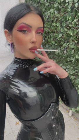 Cigarette break in my latex catsuit.