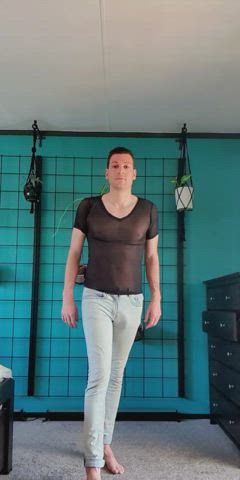 Sheer top and tight pants. Free balling