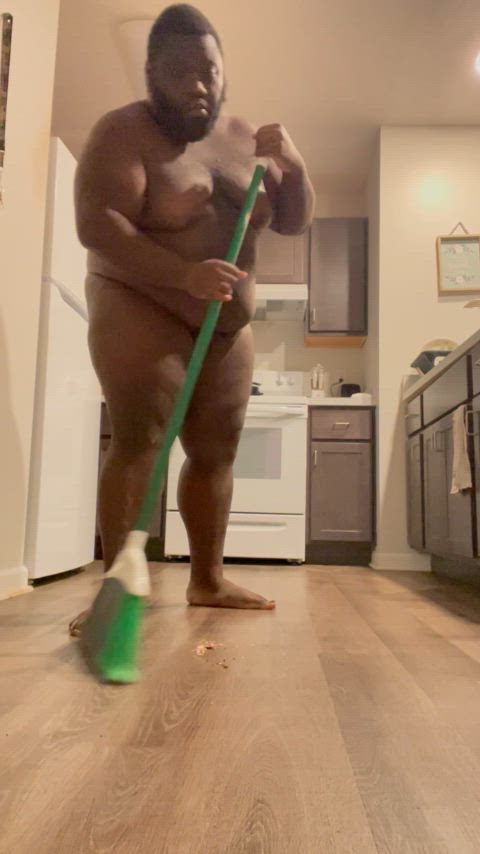 Sweeping up the kitchen.