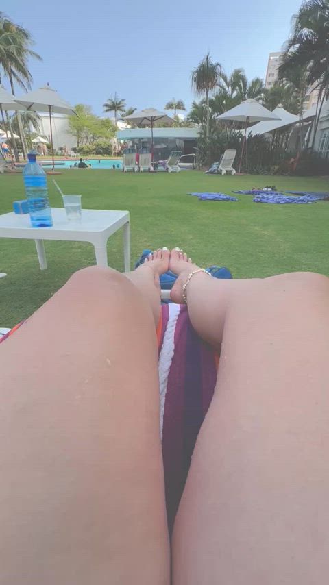 At the resort pool, showing off my arches and toes as best I can. 