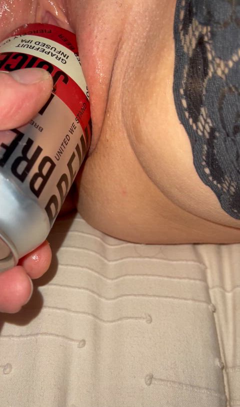 Pussy swallows beer can. 