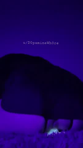 Gripping my big fantasy dildo under a UV light~