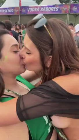 brunette festival girls kissing lesbians long hair passionate public sensual gif
