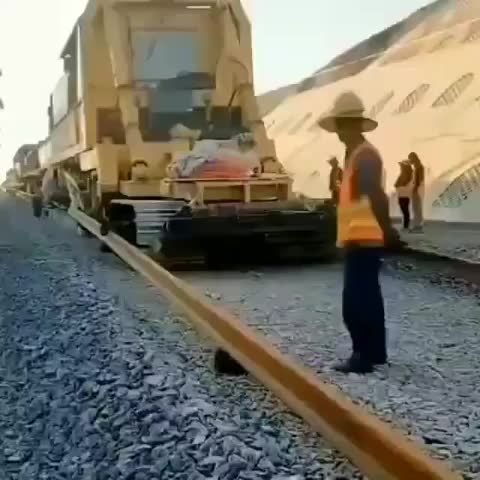 ripsave - This railroad construction machine that lays ties, lays and spikes the