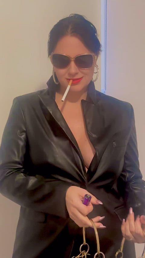 A lot cigarette and leather, the look of a badgirl