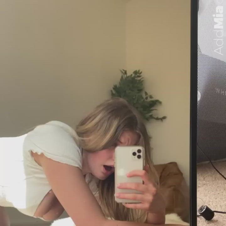 Filming herself in the mirror