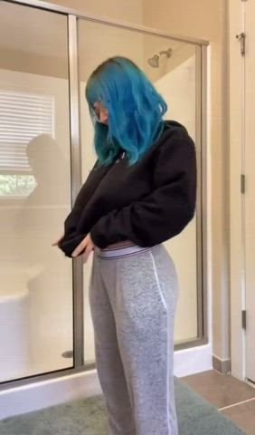 Blue haired girl showing off