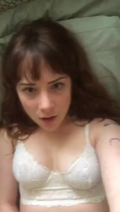 Adorable Blue Eyed Brunette masturbates while looking into camera