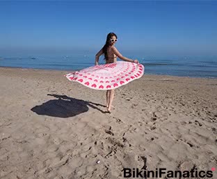Micro thong bikini flaunting on the beach