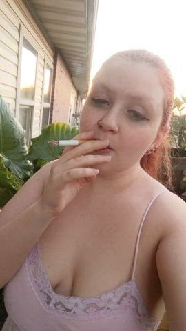 outdoor redhead smoking teasing tits gif
