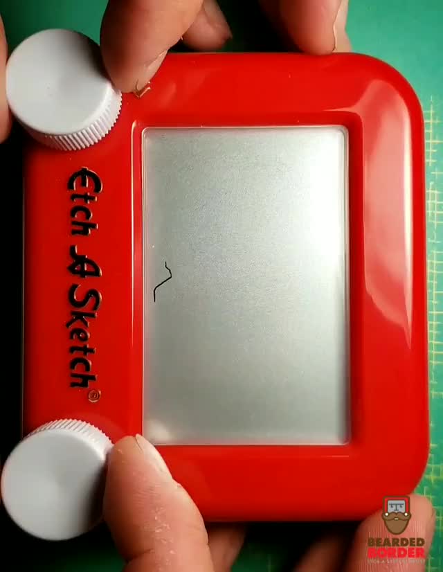 Salvador Dali created vertically on a Etch a Sketch