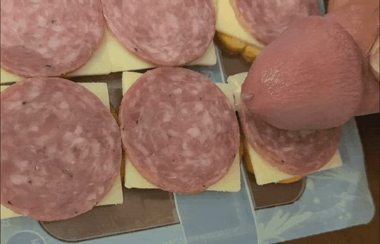 Cumming on slices of mortadella